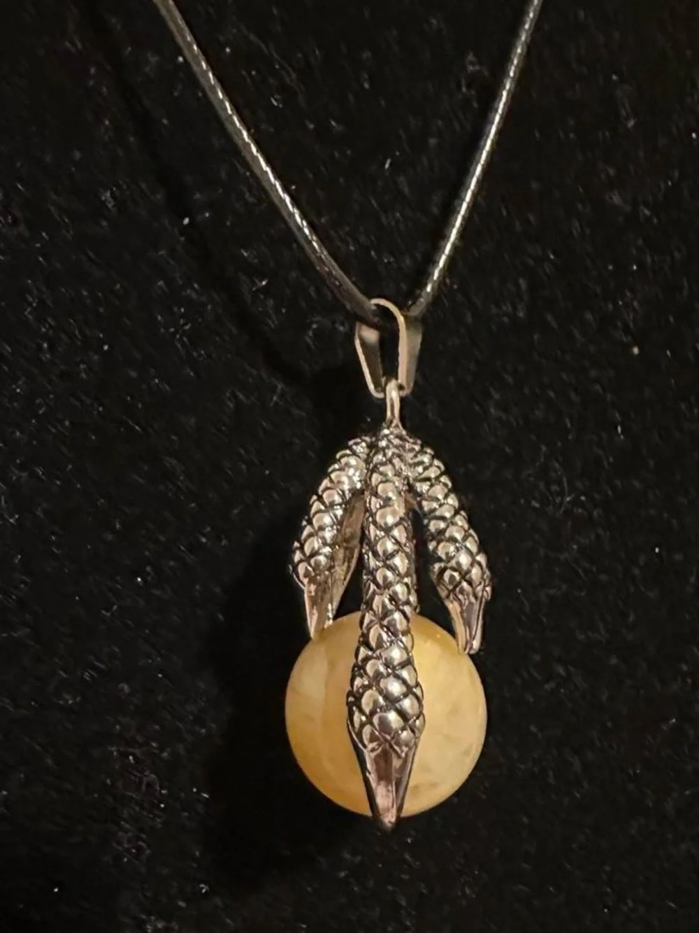 Silver dragon claw pendant necklace with big yellow aventurine crystal ball.